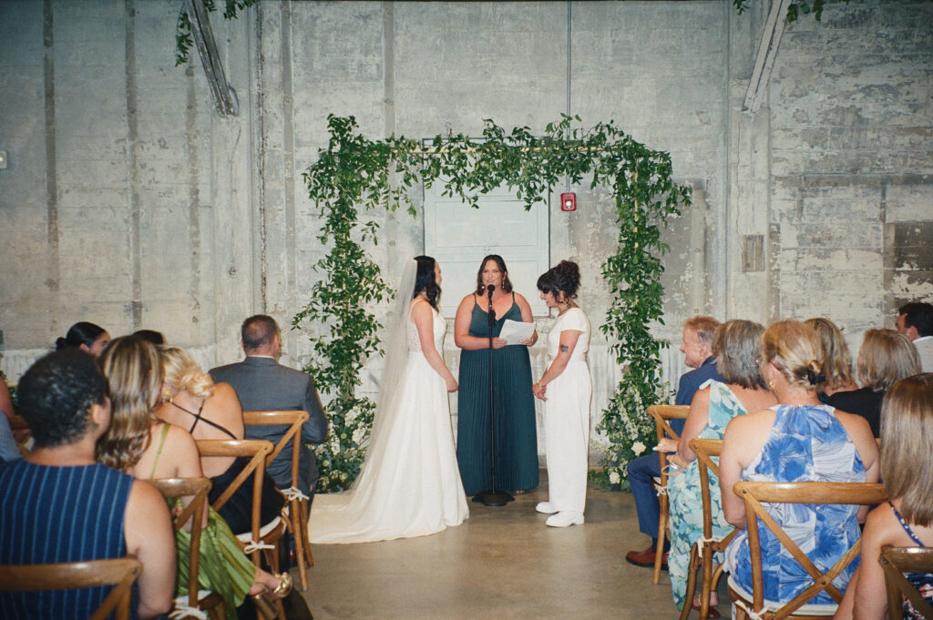 A couple takes their vows at the Garage B wedding event venue