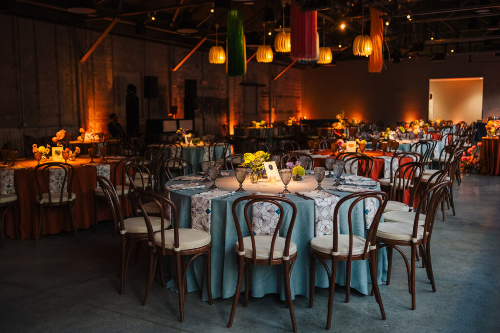 A cozy atmosphere with tables and chairs at a wedding venue